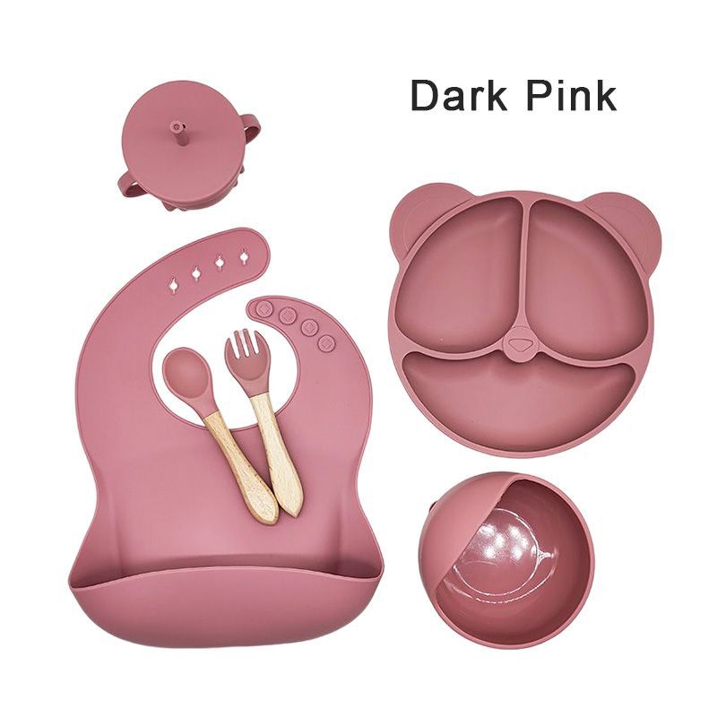 Silicone dinner plate set includes bib, spoon, and cup.