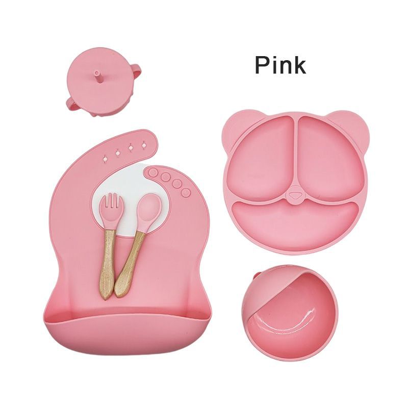 Silicone dinner plate set includes bib, spoon, and cup.