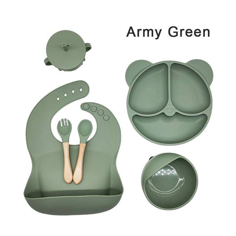 Silicone dinner plate set includes bib, spoon, and cup.