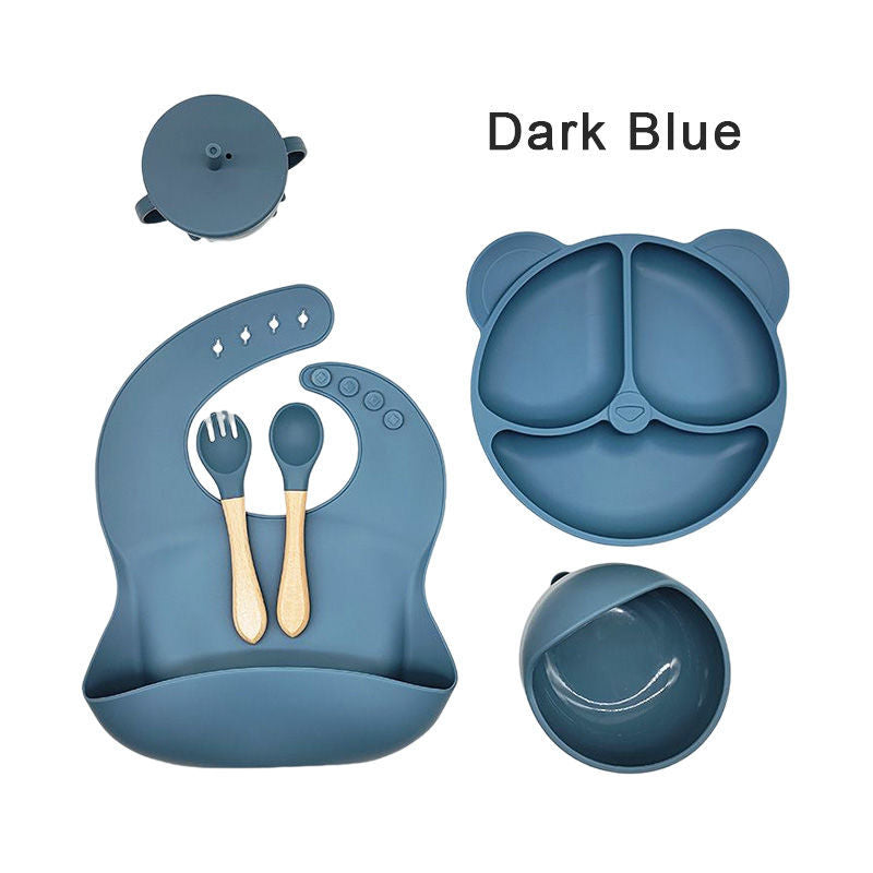 Silicone dinner plate set includes bib, spoon, and cup.